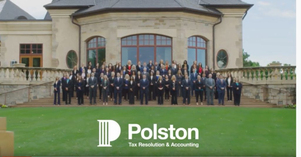 Polston Tax team standing on steps in front of a building