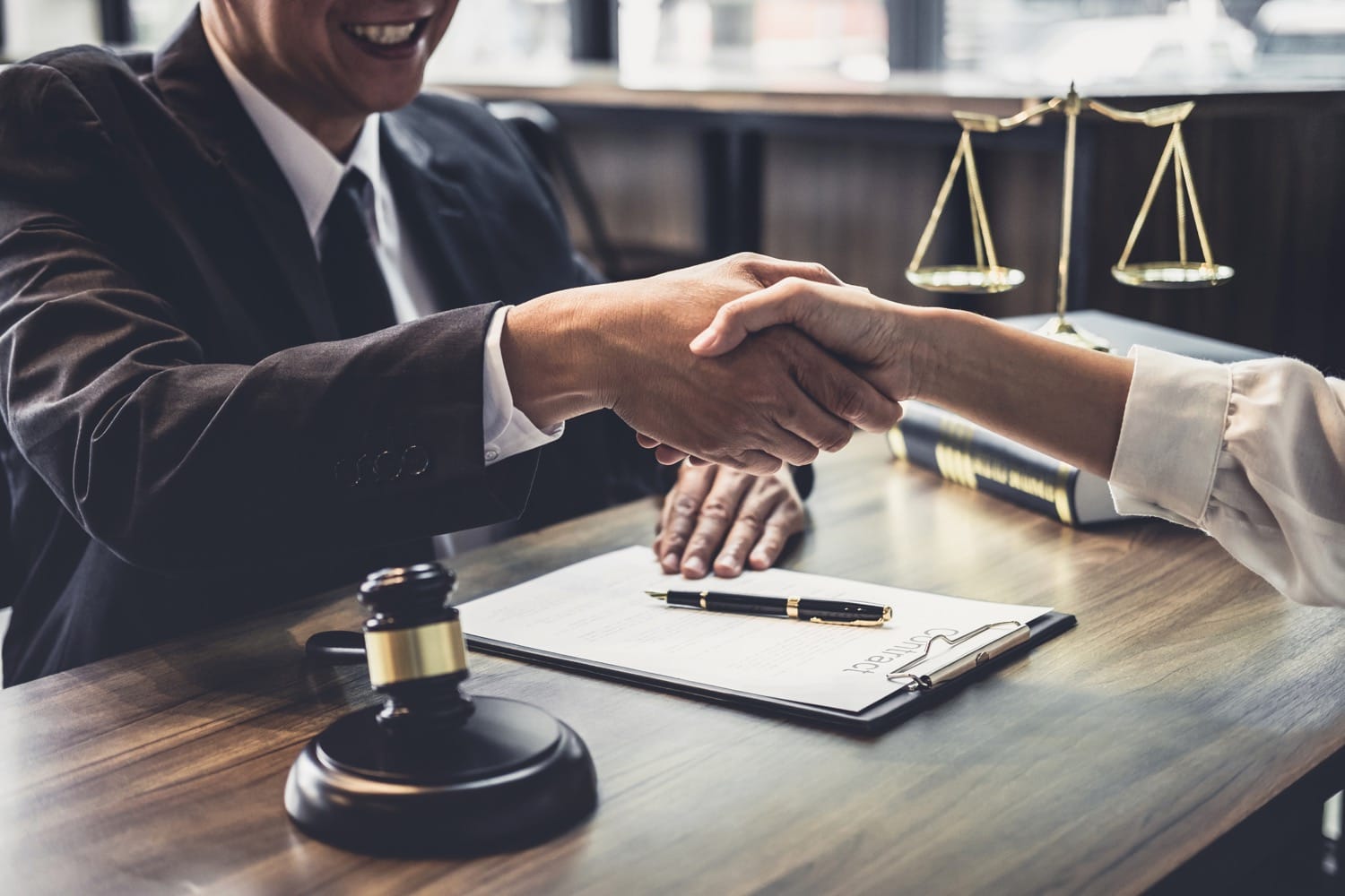 Attorney and client shaking hands